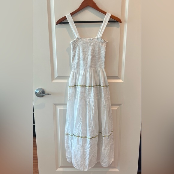 THE GREAT. The Clover Smocking Sleeveless Embroidered Floral Mid Dress - Picture 9 of 16